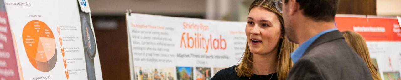 Student presenting their internship poster at the Expo